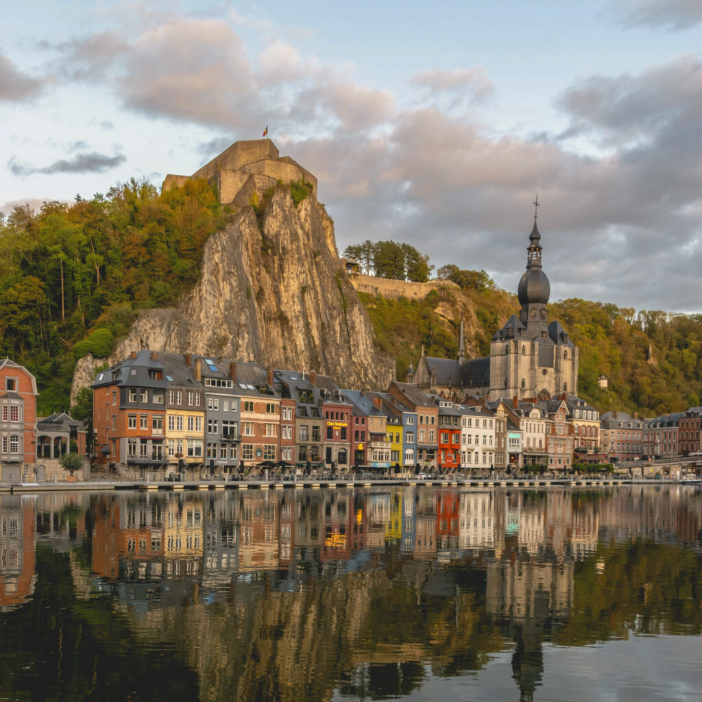 underrated cities in Belgium- the city of Dinant from the Meuse river 